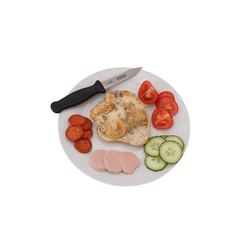 Jorg Sprave bread knife shown on a breakfast plate